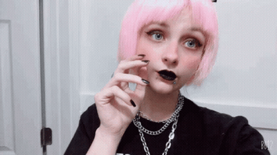 A Girl With Pink Hair And Black Nails Is Taking A Selfie With B612 GIF