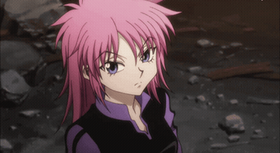 A Girl With Pink Hair And Blue Eyes Is Wearing A Purple Shirt GIF