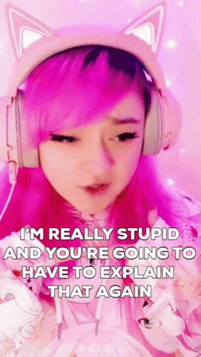 A Girl With Pink Hair And Cat Ears Is Wearing Headphones And Making A Face . GIF