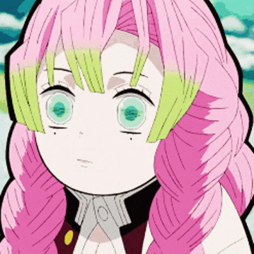 A Girl With Pink Hair And Green Eyes Is Making A Funny Face . GIF