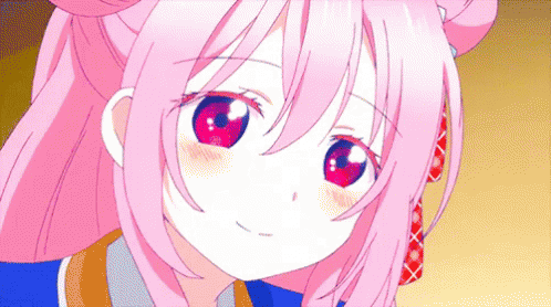 A Girl With Pink Hair And Red Eyes Looks At The Camera GIF