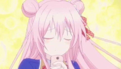 A Girl With Pink Hair Is Holding A Pink Phone In Her Hand GIF