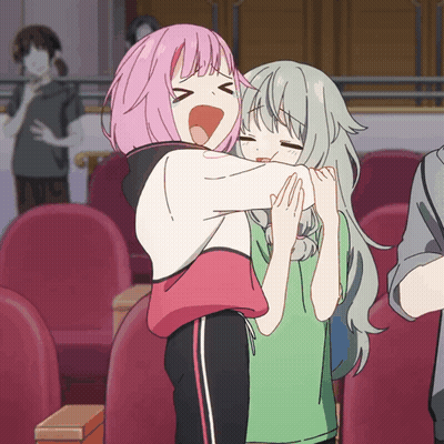 A Girl With Pink Hair Is Hugging Another Girl GIF