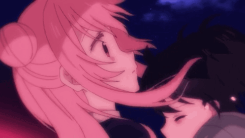 A Girl With Pink Hair Is Kissing A Boy GIF