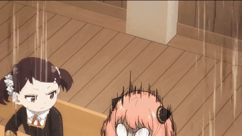 A Girl With Pink Hair Is Making A Funny Face While Another Girl Looks Angry GIF