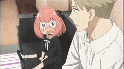 A Girl With Pink Hair Is Sitting On A Couch Next To A Man In A White Shirt GIF