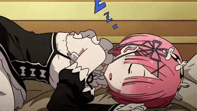 A Girl With Pink Hair Is Sleeping On A Bed With Her Head On A Pillow . GIF
