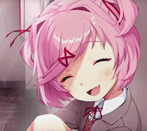 A Girl With Pink Hair Is Smiling And Holding Something GIF