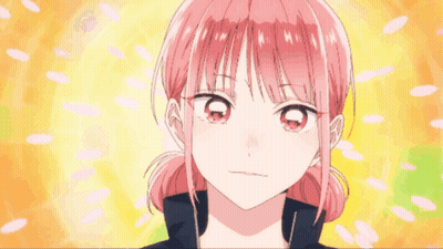 A Girl With Pink Hair Is Smiling With Her Fist Up GIF