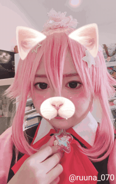 A Girl With Pink Hair Is Wearing A Cat Costume And Has The Number 070 On Her Face GIF