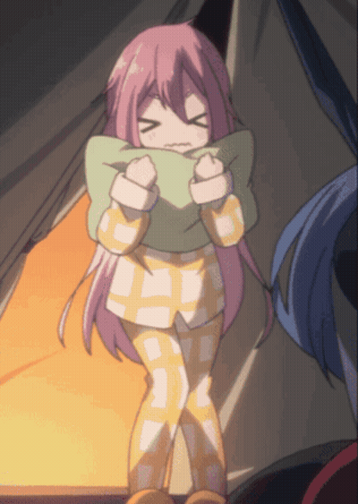 A Girl With Pink Hair Is Wrapped In A Pillow GIF