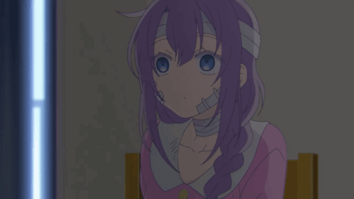 A Girl With Purple Hair And A Bandage On Her Head Sits In A Chair GIF