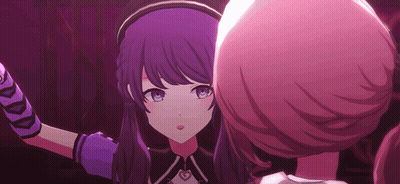 A Girl With Purple Hair And Blue Eyes Is Standing Next To Another Girl With Pink Hair . GIF