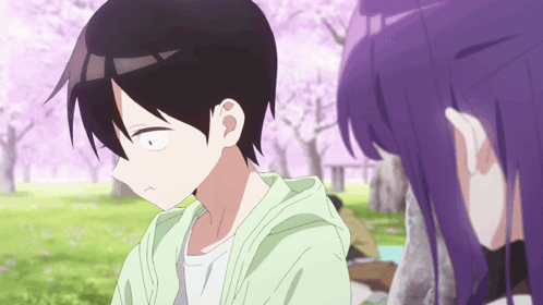 A Girl With Purple Hair Looks At A Boy In A Park GIF
