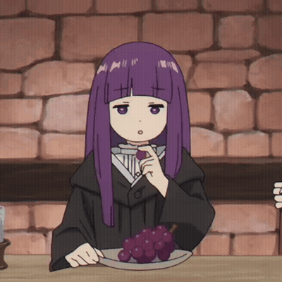 A Girl With Purple Hair Sits At A Table With A Plate Of Grapes On It GIF