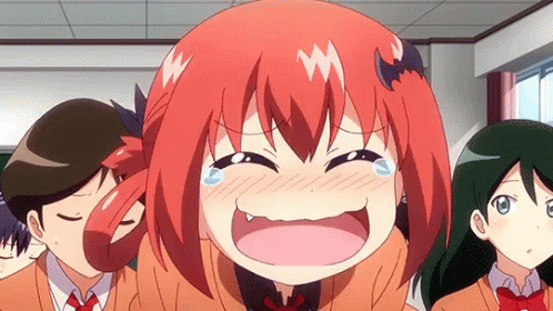 A Girl With Red Hair And A Bat On Her Head Is Laughing And Crying In A Classroom . GIF