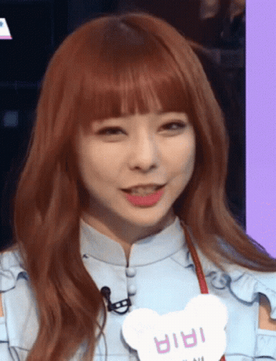 A Girl With Red Hair And A Name Tag That Says ' Iria ' GIF