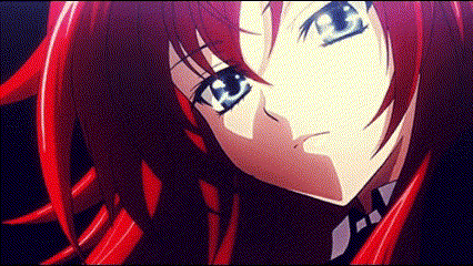 A Girl With Red Hair And Blue Eyes Is Looking At The Camera GIF