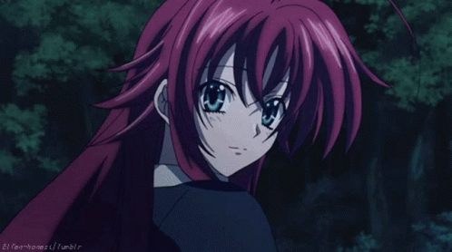 A Girl With Red Hair And Blue Eyes Is Looking At The Camera With A Tumblr Logo In The Lower Right Corner GIF