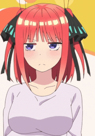 A Girl With Red Hair And Blue Eyes Is Making A Face GIF