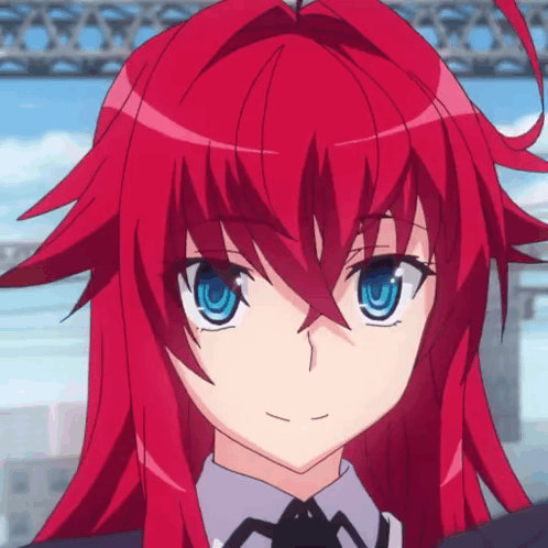 A Girl With Red Hair And Blue Eyes Is Wearing A Suit And Tie GIF