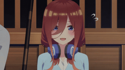 A Girl With Red Hair And Blue Eyes Is Wearing Headphones And Making A Surprised Face GIF