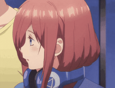 A Girl With Red Hair And Blue Eyes Is Wearing Headphones With The Letter A On It GIF