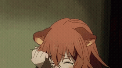 A Girl With Red Hair And Cat Ears Is Holding Her Hair . GIF