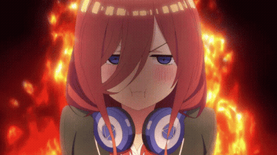 A Girl With Red Hair And Headphones Looks Angry GIF