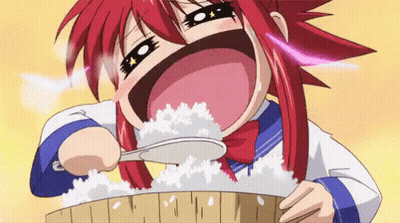 A Girl With Red Hair Is Holding A Spoon In Her Mouth And Eating Rice . GIF