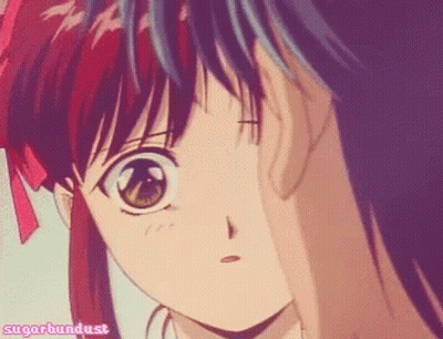 A Girl With Red Hair Is Looking At A Boy With Blue Hair With The Words Sugarbundust Written On The Bottom GIF