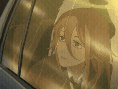 A Girl With Red Hair Is Looking Out A Car Window GIF