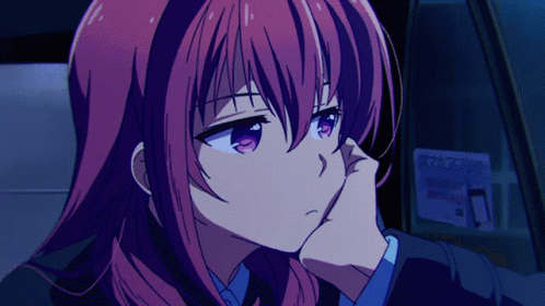 a girl with red hair is sitting in a car with a phone sticker on the window