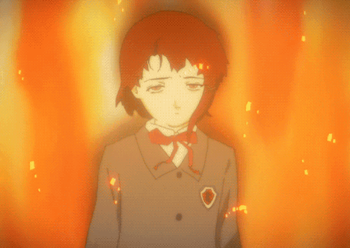 A Girl With Red Hair Is Standing In Front Of A Fire Background GIF