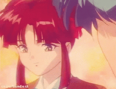 A Girl With Red Hair Is Standing Next To A Boy With Blue Hair And The Words Sugarhounddust On The Bottom GIF