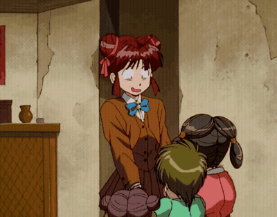 A Girl With Red Hair Is Standing Next To Two Other Girls In A Room GIF