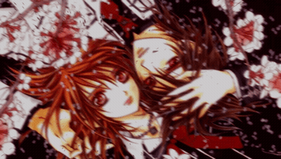 A Girl With Red Hair Is Surrounded By Flowers And Petals GIF
