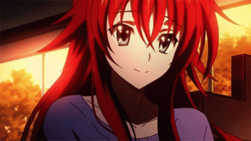 A Girl With Red Hair Is Wearing A Blue Top GIF