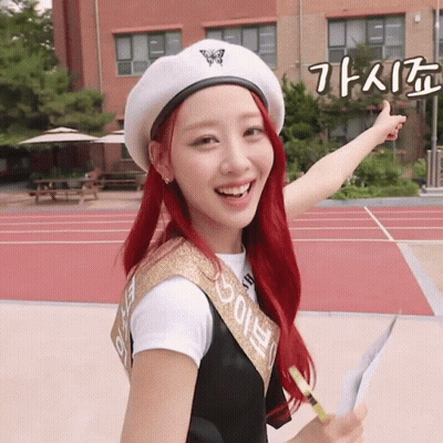 A Girl With Red Hair Is Wearing A White Beret And A Sash That Says ' Eunbi ' On It GIF