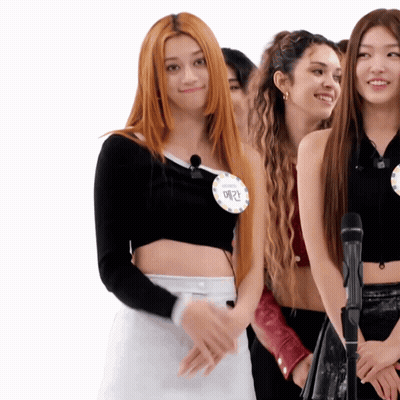 A Girl With Red Hair Wears A Name Tag That Says ' Emma ' GIF