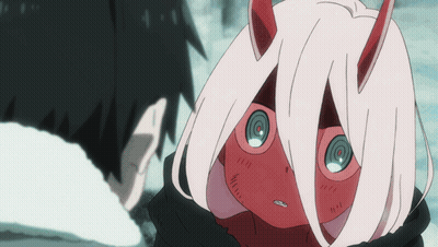 A Girl With Red Horns And Pink Hair Looks At A Man GIF