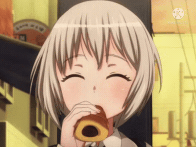A Girl With Short White Hair Is Eating A Donut And Smiling For The Camera GIF