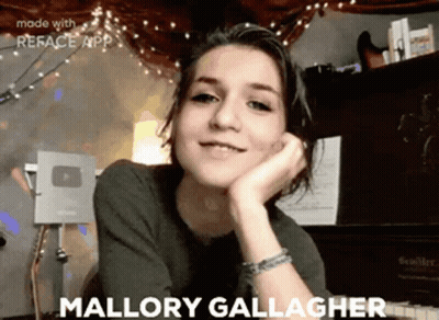 A Girl With The Name Mallory Gallagher Written On Her Face GIF