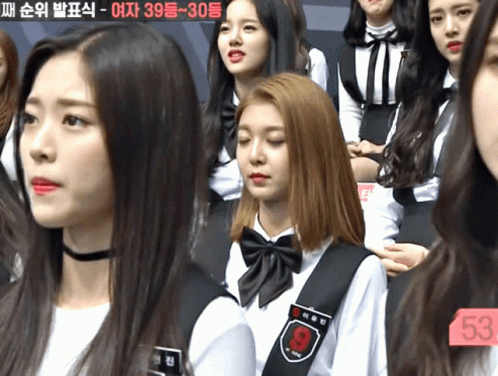A Girl With The Number 53 On Her Chest Sits In A Crowd GIF