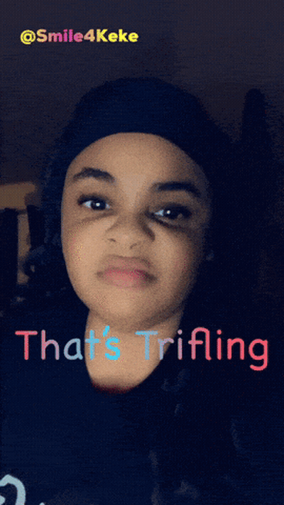 A Girl With The Words That 'S Trifling Written On Her Face GIF