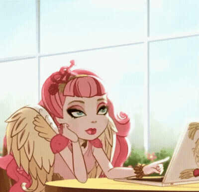 A Girl With Wings Is Sitting At A Table With A Laptop And Pointing At It GIF