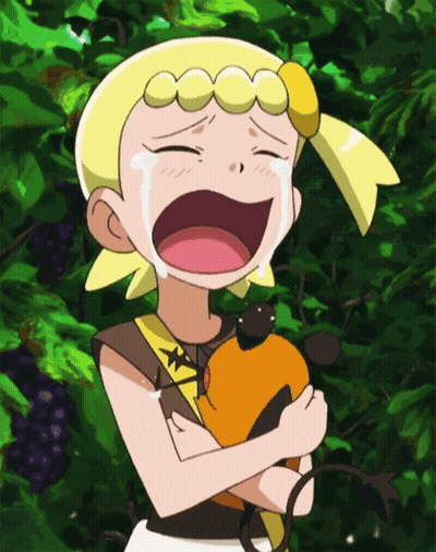 A Girl With Yellow Hair Is Crying While Holding An Orange Animal GIF