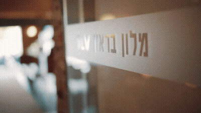 A Glass Door Has A Sticker On It That Says Mcll GIF