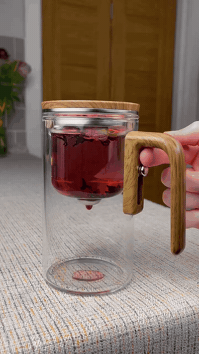 A Glass Mug With A Wooden Handle And A Lid That Says ' Oasis ' On It GIF