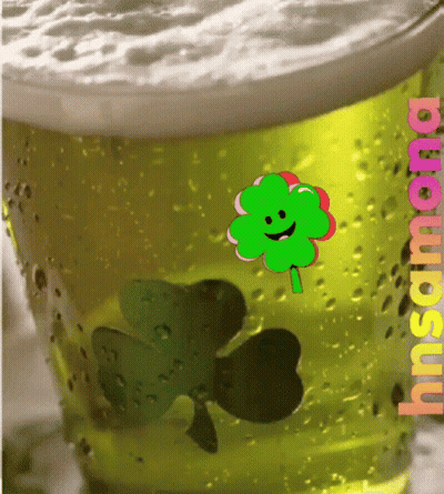A Glass Of Beer With A Clover And The Word Insana On The Bottom GIF